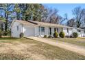 White brick ranch home with a long driveway at 3766 Stanford Cir, Decatur, GA 30034