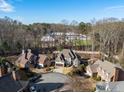 Houses in a cul-de-sac with mature trees and landscaping at 1240 Woodlawn Ne Dr, Marietta, GA 30068