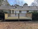 New deck with wood railings overlooking backyard at 1737 Ramblewood Way, Snellville, GA 30078