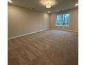 Spacious carpeted bedroom with large window at 3305 Cranston Ln, Kennesaw, GA 30144