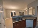 Eat-in kitchen featuring granite countertops, double sink, and a view of the dining area at 4461 Ravenwood Dr, Union City, GA 30291