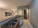 Modern kitchen with granite countertops, stainless steel appliances, and ample cabinetry at 4461 Ravenwood Dr, Union City, GA 30291