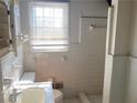 Classic bathroom with white tile and shower/tub combo at 4617 Cedar Park Dr, Stone Mountain, GA 30083