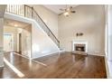 Spacious living room with hardwood floors, fireplace, and high ceilings at 255 Southshore Ln, Dallas, GA 30157