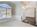 Bright dining room with hardwood floors, large windows, and a chandelier at 1260 Lakehaven Pkwy, Mcdonough, GA 30253