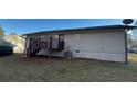 Rear view of house showing deck and AC unit at 206 Sherwood Loop, Mcdonough, GA 30253