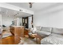 Spacious living room featuring a sectional sofa and hardwood floors at 3630 Peachtree Ne Rd # 2005, Atlanta, GA 30326