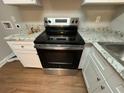 Stainless steel range and granite countertops at 2043 Chicago Nw Ave, Atlanta, GA 30314