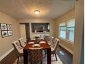 Elegant dining room featuring a wood table and six chairs at 2669 Blount St, Atlanta, GA 30344