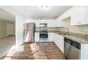 Modern kitchen with stainless steel appliances and granite countertops at 1129 Winston Dr, Decatur, GA 30032