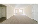 Spacious living room with neutral carpeting and walls at 1129 Winston Dr, Decatur, GA 30032