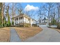Inviting two-story home features a driveway, attached garage, and well-maintained landscaping at 837 Pine Ridge Dr, Lawrenceville, GA 30043