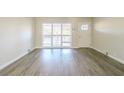 Bright living room featuring hardwood floors and large windows at 1583 Tanager Cir, Decatur, GA 30032