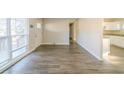 Open living area with hardwood floors and access to kitchen at 1583 Tanager Cir, Decatur, GA 30032