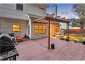 Deck with pergola, table, chairs, and grill; adjacent to house at 255 Thornbush Ln, Lawrenceville, GA 30046