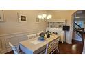 Formal dining room with hardwood floors and a built-in hutch at 2611 Cannon Farm Ln, Duluth, GA 30097