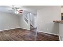 Living room showing stairs, hardwood floors, ceiling fan and neutral paint at 2295 Creekview Trl, Decatur, GA 30035