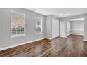 Beautiful living room with modern gray walls, white trim, and wood-look floors throughout at 2295 Creekview Trl, Decatur, GA 30035