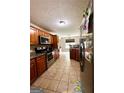 Kitchen with stainless steel appliances and wood cabinets at 520 Millbrook Village Dr, Tyrone, GA 30290