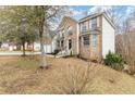 Two-story brick home with a well-maintained lawn and large trees at 6834 Fireside Ln, South Fulton, GA 30349
