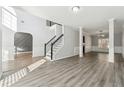 Two story foyer with hardwood floors and neutral colors at 3736 Busker Mill Ln, Ellenwood, GA 30294
