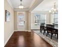 Elegant dining room with hardwood floors and chandelier at 4705 Sanderling St, Cumming, GA 30041