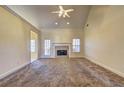 Spacious living room with a fireplace and vaulted ceiling at 216 Chad Ln, Loganville, GA 30052