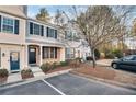 Two story townhome with brick and siding, front porch, and landscaping at 273 Devonshire Dr, Alpharetta, GA 30022