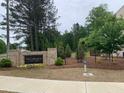 Landscaped community sign for The Collections at Wolf Creek at 1356 Lucan Ln # Wc226, Lawrenceville, GA 30043