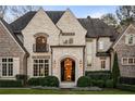 Elegant home entrance featuring a grand arched entryway at 4844 Elkhorn Hill Dr, Suwanee, GA 30024