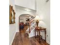 Welcoming foyer showcasing hardwood floors, staircase, and an arched doorway leading to the living room at 1503 Dolcetto Nw Trce # 2, Kennesaw, GA 30152