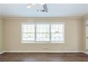 Living room with hardwood floors and a large window at 2833 Lynda Pl, Decatur, GA 30032