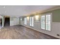 Spacious living room with hardwood floors and plantation shutters at 4617 Dunover Cir, Dunwoody, GA 30360