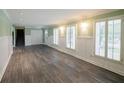 Spacious living room with hardwood floors and light green walls at 4617 Dunover Cir, Dunwoody, GA 30360
