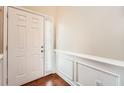 Bright entryway with hardwood floors and wainscoting at 1600 Watercress Se Ct, Mableton, GA 30126