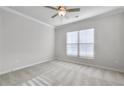 Bright bedroom with large window and ceiling fan at 2798 Turnwater St, Hoschton, GA 30548