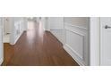 Bright hallway with hardwood floors and wainscoting at 2798 Turnwater St, Hoschton, GA 30548