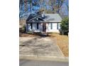 Charming one-story home with gray siding and a burgundy front door at 906 Westland Sw Dr, Marietta, GA 30064