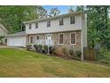 Two-story house with stone accents and a large backyard at 1529 Bell Flower Ct, Stone Mountain, GA 30088