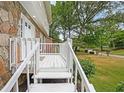 White wooden staircase leading to a charming front porch at 1529 Bell Flower Ct, Stone Mountain, GA 30088