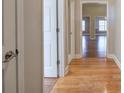 Hardwood floors and neutral walls in this home hallway at 2500 Rosehill Cir, Lithia Springs, GA 30122