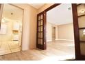 Bright entryway with wood flooring, leading to living and kitchen areas at 2400 Reynolds Rd Sw, Atlanta, GA 30331