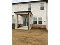 Covered patio with access from sliding glass doors at 3313 Bell Nook Way, Lawrenceville, GA 30044