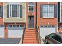 Brick townhouse with attached garage and front steps at 1506 Lavista Proper Cir, Decatur, GA 30033