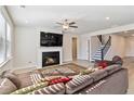 Spacious living room with a fireplace and comfortable seating at 2131 Landsburg Way, Lawrenceville, GA 30043