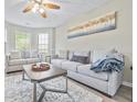 Spacious living room with large windows and plush sofas at 4266 Cabretta Se Dr, Smyrna, GA 30080