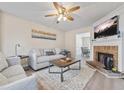 Living room features a fireplace, hardwood floors, and comfortable seating at 4266 Cabretta Se Dr, Smyrna, GA 30080