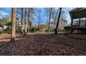 Spacious backyard with mature trees and a mostly clear yard at 3340 Berkshire Se Bnd, Conyers, GA 30013