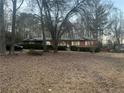 Ranch house with a large yard and trees at 3421 Fawn Trl, Marietta, GA 30066