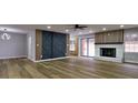 Spacious living room with hardwood floors, fireplace, and modern barn doors at 3421 Fawn Trl, Marietta, GA 30066